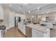 Bright, open kitchen with a large island and stainless steel appliances at 18916 W Laurel Ln, Surprise, AZ 85388