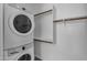 Convenient stackable washer and dryer and useful shelving for easy laundry access at 18916 W Laurel Ln, Surprise, AZ 85388
