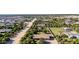 Aerial perspective of the neighborhood showing surrounding trees and homes at 19006 E Karsten Dr, Queen Creek, AZ 85142