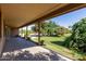 Spacious covered patio perfect for outdoor entertaining overlooking the lush backyard at 19006 E Karsten Dr, Queen Creek, AZ 85142