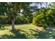 Spacious backyard features mature trees and manicured lawn at 19006 E Karsten Dr, Queen Creek, AZ 85142