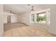 View of dining area with tile floor, large windows, and open entry to living area at 19006 E Karsten Dr, Queen Creek, AZ 85142