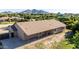 Aerial view of the home's exterior showcasing its desert landscaping and covered patio for outdoor living at 19006 E Karsten Dr, Queen Creek, AZ 85142