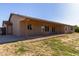 Rear view of house with covered patio and large yard area at 19006 E Karsten Dr, Queen Creek, AZ 85142