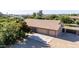 Aerial view of the house featuring a spacious driveway and a three-car garage at 19006 E Karsten Dr, Queen Creek, AZ 85142