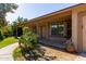 Inviting front porch with decorative potted plants enhances this home's curb appeal at 19006 E Karsten Dr, Queen Creek, AZ 85142