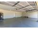 This garage features an epoxy floor and ample space for storage at 19006 E Karsten Dr, Queen Creek, AZ 85142