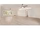 Bright living room with light vinyl floors, vaulted ceilings and plenty of natural light at 19006 E Karsten Dr, Queen Creek, AZ 85142