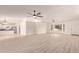 Open floor plan with vinyl floors featuring the living area and entry to kitchen at 19006 E Karsten Dr, Queen Creek, AZ 85142