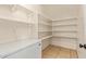 Walk-in pantry features tiled floor, shelving, and space for an additional freezer at 19006 E Karsten Dr, Queen Creek, AZ 85142