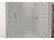 The bathroom has a shower stall, white subway tile and chrome fixtures at 19006 E Karsten Dr, Queen Creek, AZ 85142