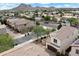 Charming home with a Spanish-style tile roof, showcasing beautiful mountain views and a well-kept neighborhood at 2004 E Heartwood Ln, Phoenix, AZ 85022