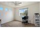 Inviting bedroom with multiple windows that let in natural light and neutral carpeting at 2004 E Heartwood Ln, Phoenix, AZ 85022