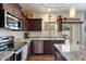 Bright kitchen featuring stainless steel appliances, generous counter space, and modern lighting fixtures at 2004 E Heartwood Ln, Phoenix, AZ 85022