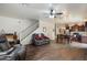 Comfortable living area showcasing modern flooring, ample space, and stairs to the upper level at 2004 E Heartwood Ln, Phoenix, AZ 85022