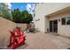 Inviting brick patio with seating area, including a grill, ideal for outdoor dining and entertaining guests at 2004 E Heartwood Ln, Phoenix, AZ 85022