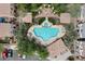 Upscale community pool area featuring ample lounge seating, charming gazebos, and lush landscaping at 2004 E Heartwood Ln, Phoenix, AZ 85022