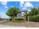 The Orchard Ranch sign with beautiful landscaping and clear visibility from the street at 21205 E Excelsior Ave, Queen Creek, AZ 85142