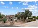 Beautiful home featuring desert landscaping, a circular driveway, and manicured lawn at 21205 E Excelsior Ave, Queen Creek, AZ 85142