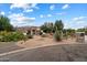 Stunning single-story home featuring desert landscaping, a private courtyard, and charming stone accents at 21205 E Excelsior Ave, Queen Creek, AZ 85142