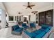 This covered patio offers comfortable seating and ample space for outdoor entertaining at 21205 E Excelsior Ave, Queen Creek, AZ 85142