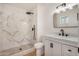 Modern bathroom featuring tiled walk-in shower, vanity and black accents at 2124 E Boston St, Chandler, AZ 85225