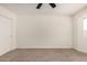 Cozy bedroom featuring neutral carpet, a ceiling fan and a closet at 2124 E Boston St, Chandler, AZ 85225