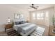 Comfortable bedroom with soft lighting, bay window, and modern decor evokes a restful atmosphere at 2124 E Boston St, Chandler, AZ 85225