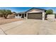 Well-maintained exterior featuring a wide driveway and attractive landscaping, creating a welcoming curb appeal at 2124 E Boston St, Chandler, AZ 85225