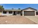 Charming single-story home featuring a desert landscape, a two-car garage, and a welcoming front entrance at 2124 E Boston St, Chandler, AZ 85225