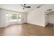 Bright living room with fan, showing flooring and front door at 2124 E Boston St, Chandler, AZ 85225