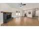 Spacious living room featuring a fireplace, backyard access, and an open layout to the kitchen at 2124 E Boston St, Chandler, AZ 85225