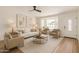Bright living room with large bay window, neutral furniture, and decorative art creates a welcoming space at 2124 E Boston St, Chandler, AZ 85225