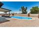 This home features a sparkling pool and low maintenance desert landscaping at 2124 E Boston St, Chandler, AZ 85225