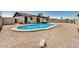This home features a sparkling pool and low maintenance desert landscaping at 2124 E Boston St, Chandler, AZ 85225