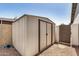 Practical outdoor shed offers additional storage space in the low maintenance backyard at 2124 E Boston St, Chandler, AZ 85225