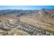 Panoramic community aerial view featuring modern homes, a winding road, and majestic mountains in the distance at 21449 W Mariposa St, Buckeye, AZ 85396
