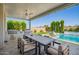 Well-appointed outdoor kitchen near a sparkling pool and dining area, ideal for entertaining at 21449 W Mariposa St, Buckeye, AZ 85396