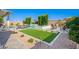 Beautifully landscaped backyard with a pool, spa, and multiple seating areas for outdoor enjoyment at 21449 W Mariposa St, Buckeye, AZ 85396