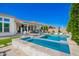 Relaxing backyard featuring a pool, lounge chairs, and mountain views; a perfect outdoor space for leisure and recreation at 21449 W Mariposa St, Buckeye, AZ 85396