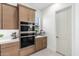 Close-up of stainless steel double ovens in a kitchen with white subway tile backsplash at 21449 W Mariposa St, Buckeye, AZ 85396