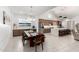 Bright, open-concept kitchen and dining area with a large island and modern appliances at 21449 W Mariposa St, Buckeye, AZ 85396
