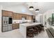 Modern kitchen featuring a large island with seating, stainless steel appliances and ample cabinetry at 21449 W Mariposa St, Buckeye, AZ 85396