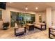Covered patio featuring a cozy seating area with a fire pit, offering a seamless indoor-outdoor living experience at 21449 W Mariposa St, Buckeye, AZ 85396