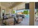 Covered patio featuring a complete outdoor kitchen, dining and cozy seating, for an enjoyable outdoor living experience at 21449 W Mariposa St, Buckeye, AZ 85396