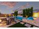 Outdoor pool area featuring a spa, lounge chairs and well-maintained landscaping creating a private retreat at 21449 W Mariposa St, Buckeye, AZ 85396