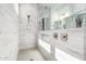 Bright tiled shower featuring a niche and dual shower heads at 21449 W Mariposa St, Buckeye, AZ 85396