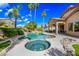 Inviting backyard oasis with a sparkling pool, spa, and lush landscaping at 2156 W Periwinkle Way, Chandler, AZ 85248