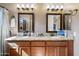 Bathroom features a double vanity with granite countertop and framed mirrors at 2156 W Periwinkle Way, Chandler, AZ 85248