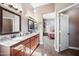 Spacious bathroom with double vanity, granite countertop, and bedroom view at 2156 W Periwinkle Way, Chandler, AZ 85248